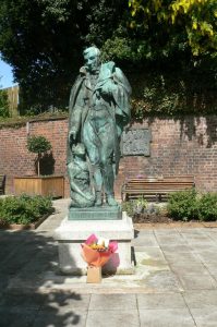 Flowers at statue (1) 253rd